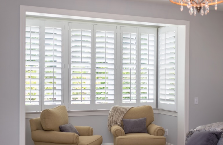 White plantation shutters in sitting area